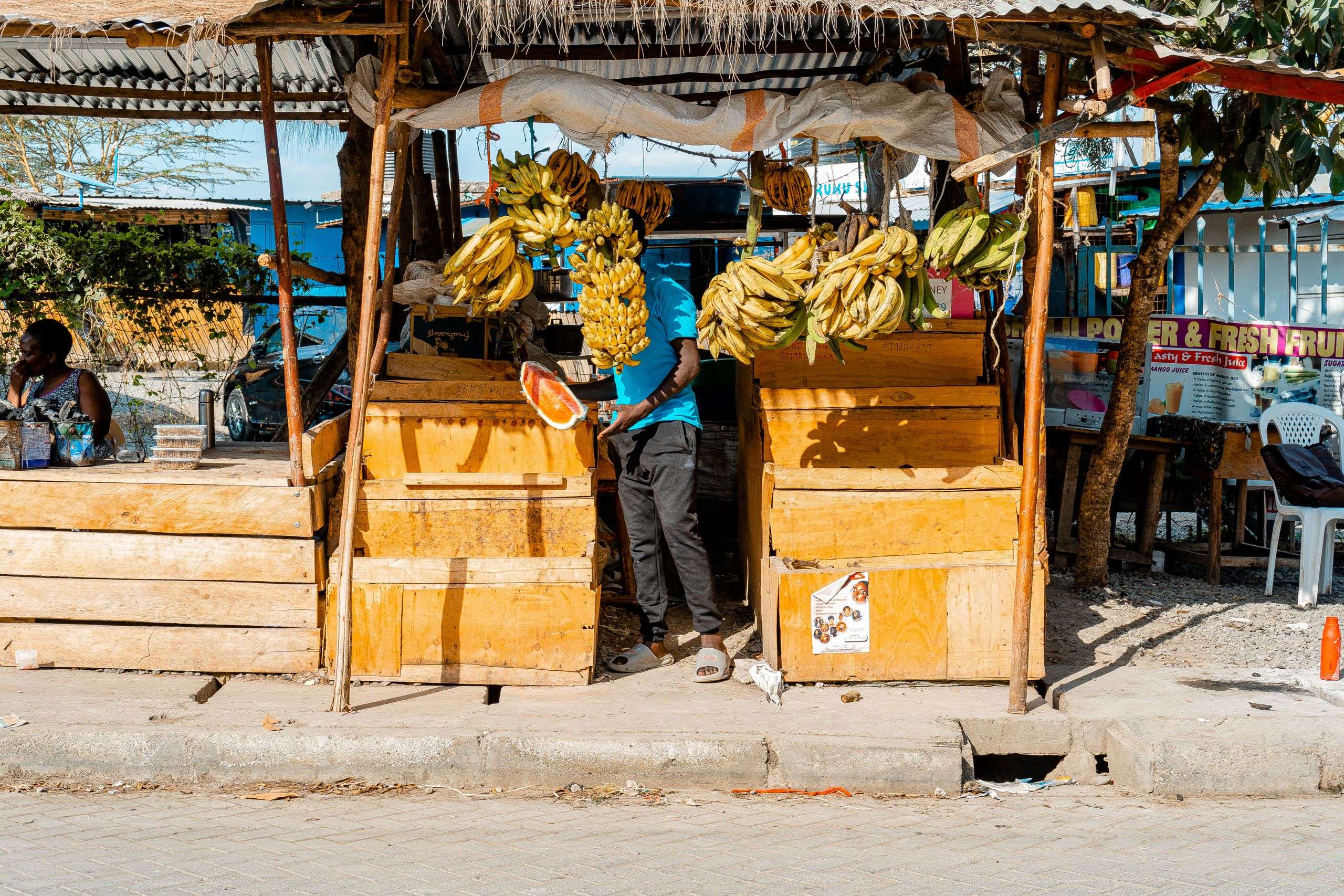 Vendors selling bananas and produce at a Nairobi street market