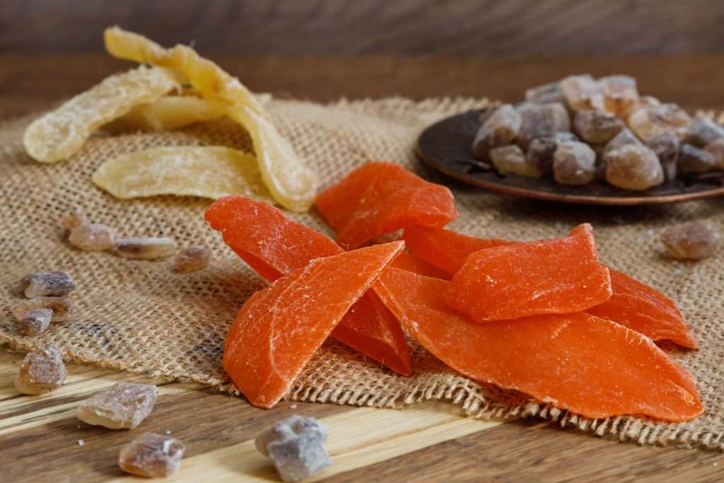 Dried fruit pieces laid out on burlap